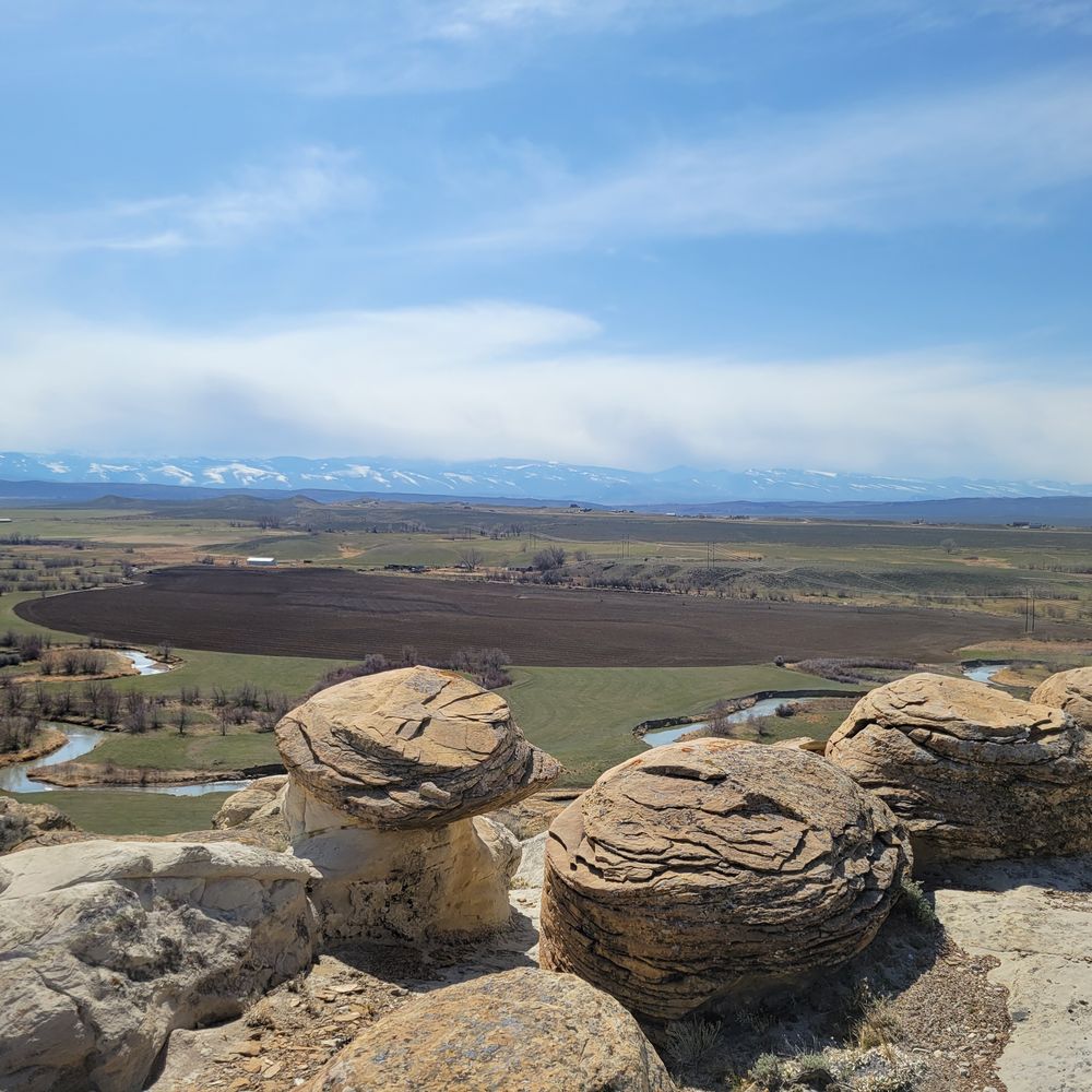 Sandstone outcrops above an agricultural river valley